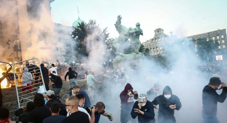 Clouds of tear gas and smoke filled central Belgrade after a peaceful gathering descended into tense confrontations between protesters and police