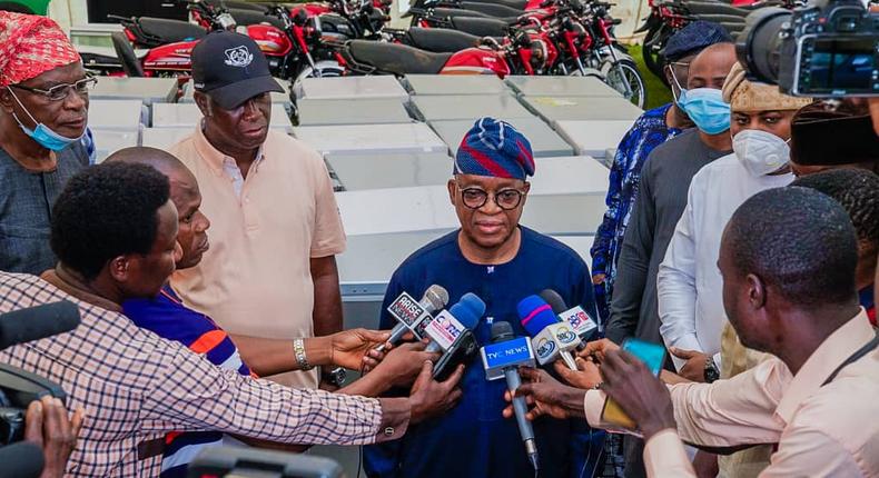Gov. Oyetola with some of his cabinet members inspecting the stolen items returned by hoodlums.  [Twitter/@GboyegaOyetola]