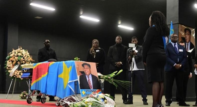 A woman stands in front of the coffin of Democratic Republic of Congo's opposition leader Etienne Tshisekedi during a funeral wake in his honour, in Brussels on February 5, 2017