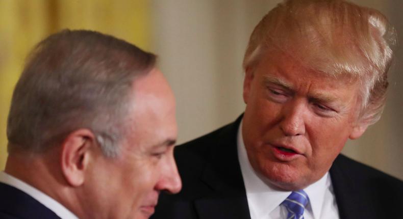 US President Donald Trump (R) looks to Israeli Prime Minister Benjamin Netanyahu hold a joint news conference at the White House in Washington, US, February 15, 2017.