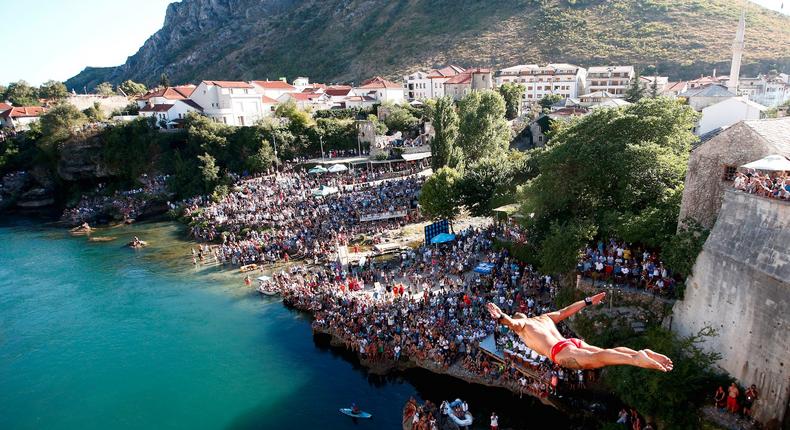 Lorens Listo jumping from the Old Bridge during the 451st traditional diving competition in Mostar, Bosnia and Herzegovina.