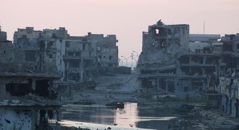 Damaged homes are seen after clashes between members of the Libyan pro-government forces and Shura Council of Libyan Revolutionaries, in a file photo. REUTERS/Stringer