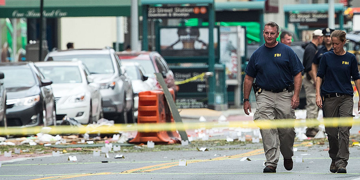 Two members of the FBI work at the scene of Saturday night's explosion in the Chelsea neighborhood of Manhattan.