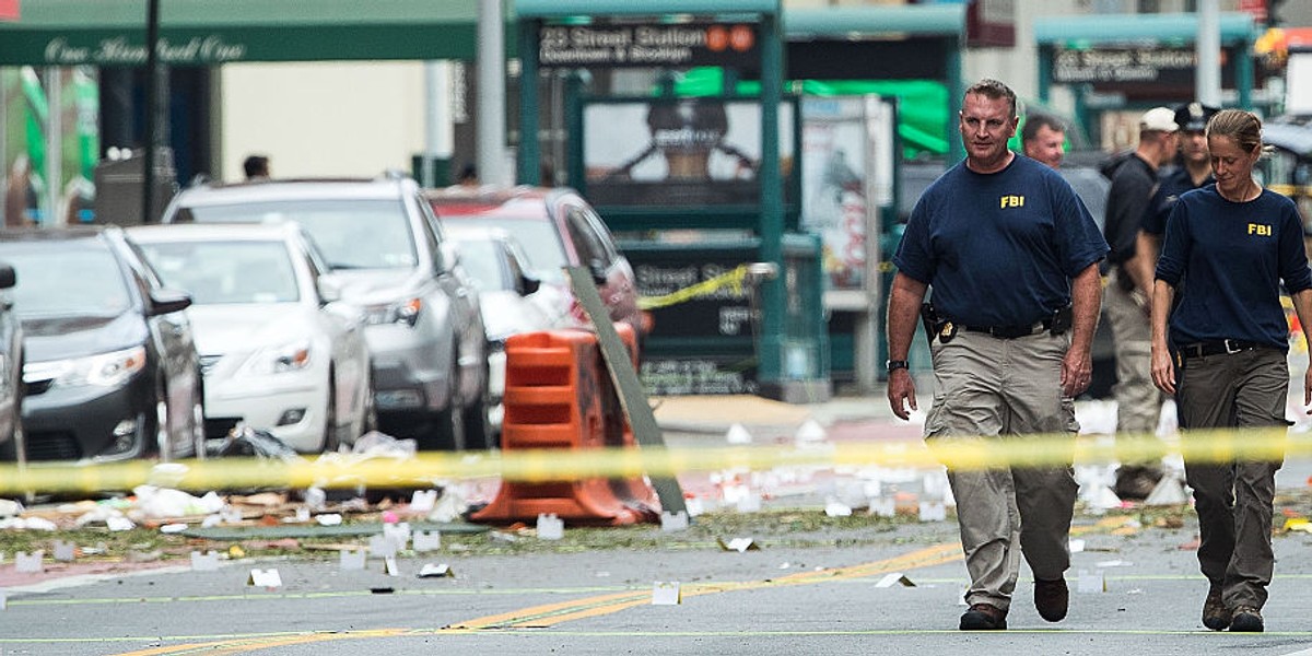 Two members of the FBI work at the scene of Saturday night's explosion in the Chelsea neighborhood of Manhattan.