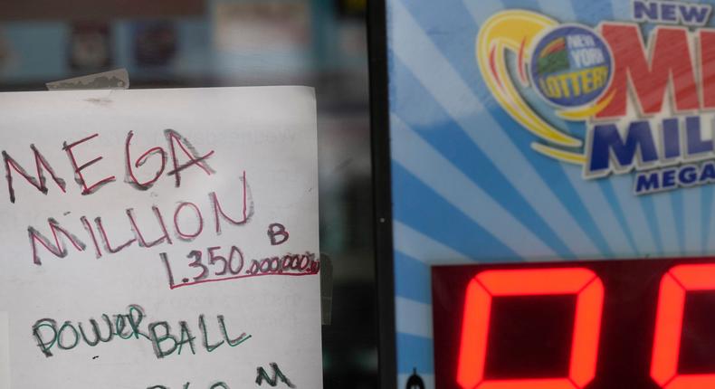 A handwritten sign advertises the new Mega Millions jackpot Wednesday, Jan. 11, 2023, in New York.Seth Wenig/AP