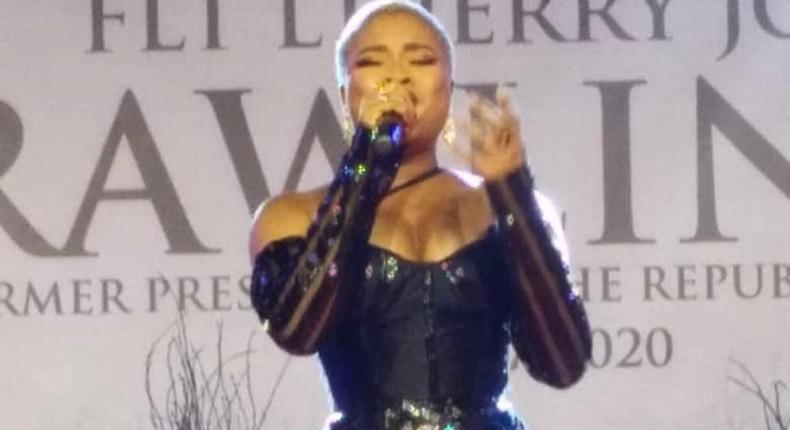 Adina tears down during emotional performance at Rawlings' vigil