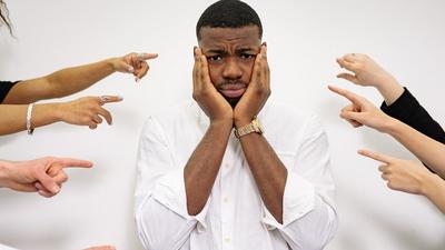 A man holding his face [Image credit: Yan Krukau]