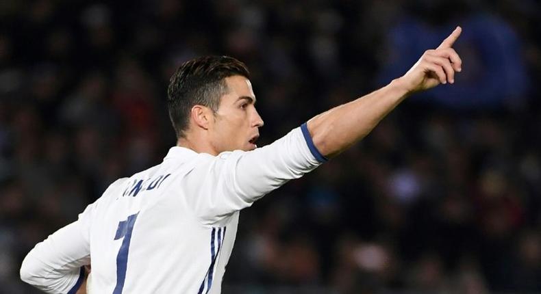 Real Madrid's Cristiano Ronaldo celebrates scoring a penalty during the Club World Cup final against Japan's Kashima Antlers in Yokohama on December 18, 2016