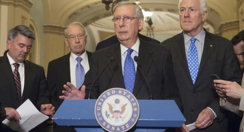 US Senate Majority Leader Republican Mitch McConnell (C) and company forged ahead to change court confirmation rules despite concerns, infuriated by Democrats' insistence on filibustering what Republicans consider a mainstream Supreme Court nominee