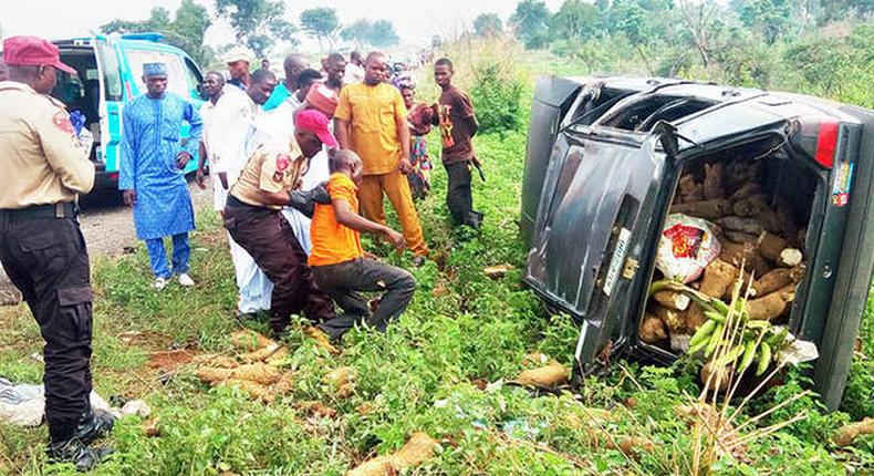 A FRSC officer offers help to an accident victim.