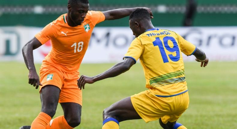 Ivory Coast's Pepe vies for the ball with Rwanda's Emmaunel Imanishimwe