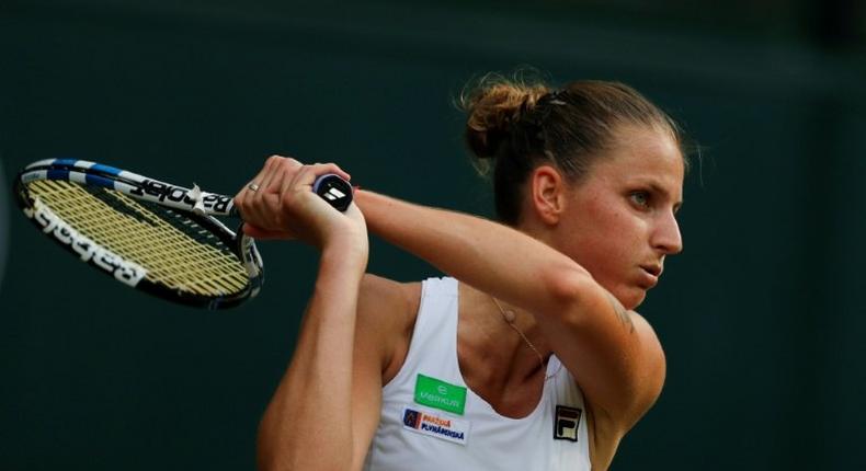 Czech Republic's Karolina Pliskova returns against Slovakia Magdalena Rybarikova during their women's singles second round match on the fourth day of the 2017 Wimbledon Championships July 6, 2017