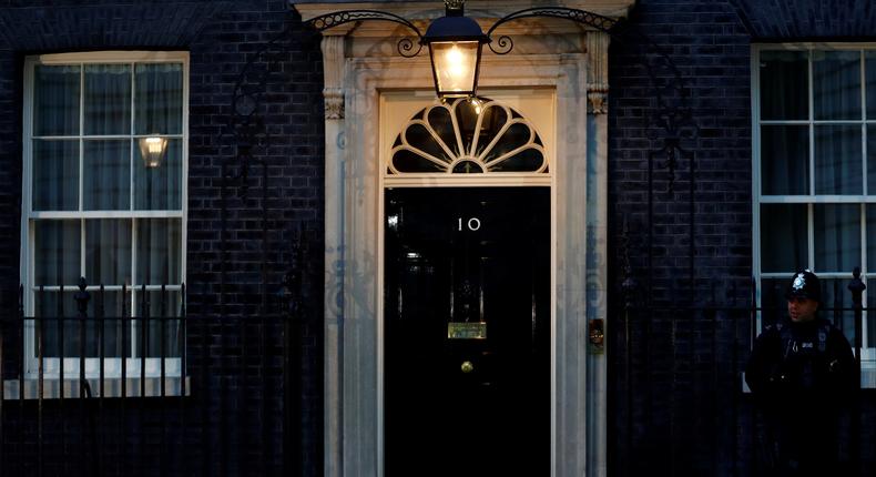 Police stand guard in front of 10 Downing Street on the night of Britain's general election in London, June 9, 2017.