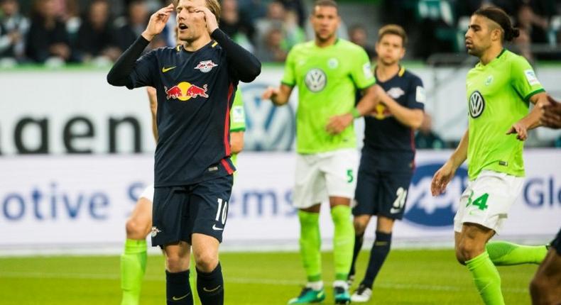 Emil Forsberg (left) groans after failing to convert a penalty for Leipzig at Wolfsburg on October 16, 2016