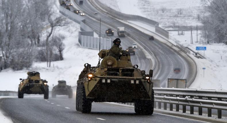 A convoy of Russian armored vehicles moves along a highway in Crimea on January 18, 2022.