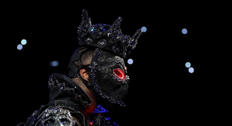 Deontay Wilder wore a mask complete with glowing red eyes for his ring walk- Credit: Reuters