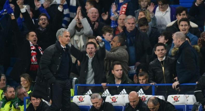 Manchester United's manager Jose Mourinho (L) starts walking toward the tunnel at the final whistle on October 23, 2016