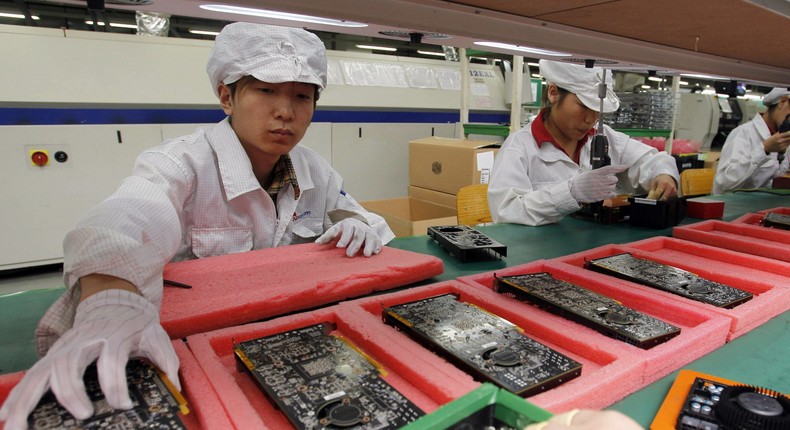 Workers on the production line at the Foxconn complex in Shenzhen, Southern city in China, on May 26, 2010.Kin Cheung/AP