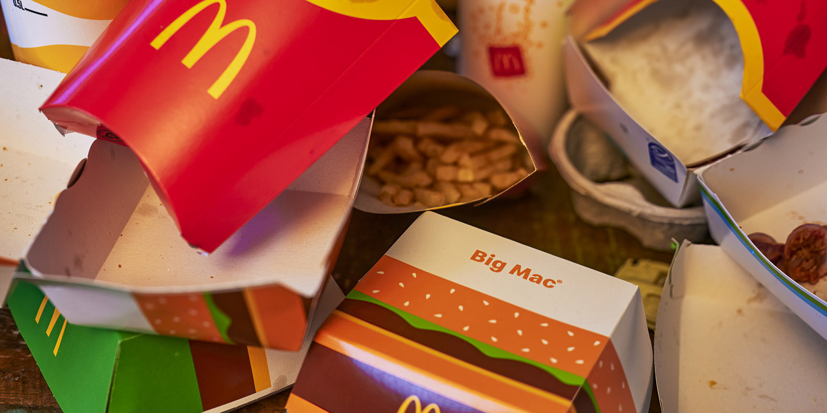 Waste from a fast food meal lying on a table.