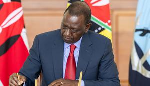 President William Ruto signs a document at State House, Nairobi on May 2, 2024