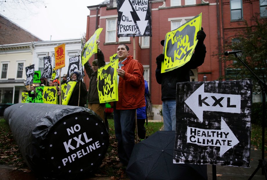 Climate advocates and representatives from the Rosebud Sioux Tribe in South Dakota protest against the Keystone XL pipeline in front of the home, center, of US Senator Mary Landrieu (D-Louisiana), November 17, 2014.