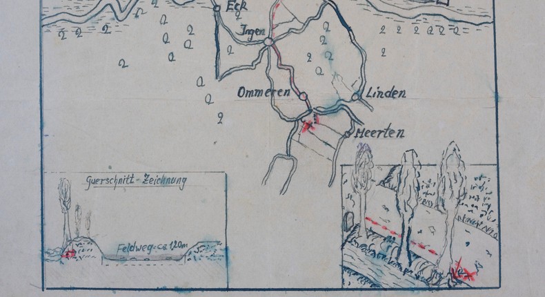 The map showing where the Nazi loot was reportedly buried in Ommeren, near Arnhem, is seen at the National Archive of the Netherlands in The Hague, Monday, Jan. 23, 2023. A hand-drawn map with a red letter X purportedly showing the location of a buried stash of precious jewelry looted by Nazis from a blown-up bank vault has sparked a modern-day treasure hunt in a tiny Dutch village.AP Photo/Peter Dejong