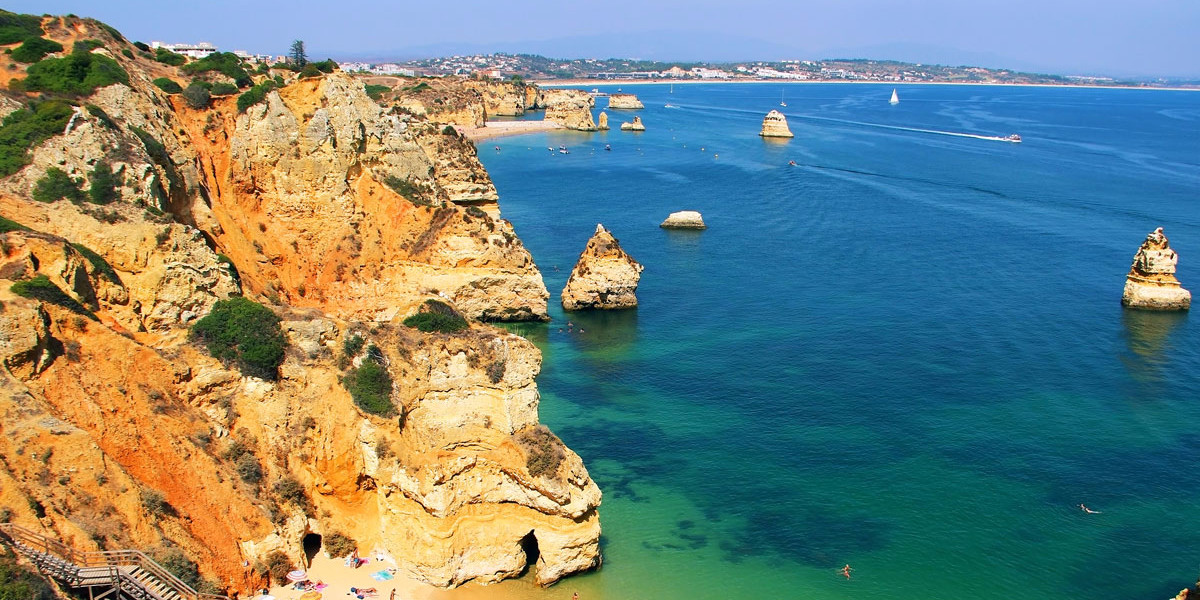 Take the stairs to reach the secluded Praia do Camilo in Lagos, Portugal.