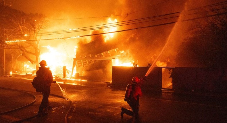 Firefighters battle fires razing beachfront homes along Pacific Coast Highway in Malibu in the Palisades Fire.MediaNews Group/Los Angeles Daily News via Getty Images/MediaNews Group via Getty Images