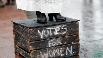 Councillor Elaine Pantling, dressed as suffragette Alice Hawkins, speaks during an event to mark 100 years of votes for women in Leicester