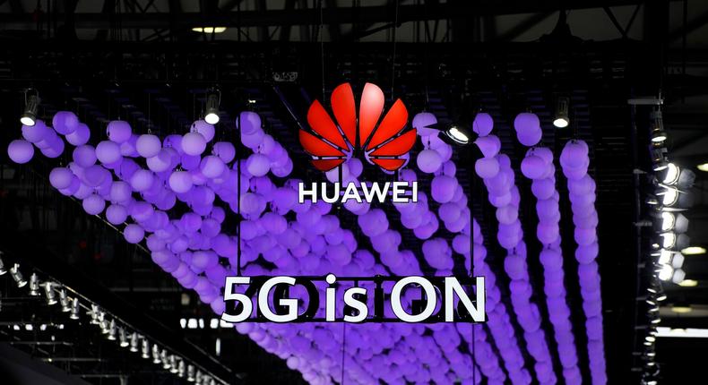 FILE PHOTO: A Huawei logo and a 5G sign are pictured at Mobile World Congress (MWC) in Shanghai, China June 28, 2019. REUTERS/Aly Song