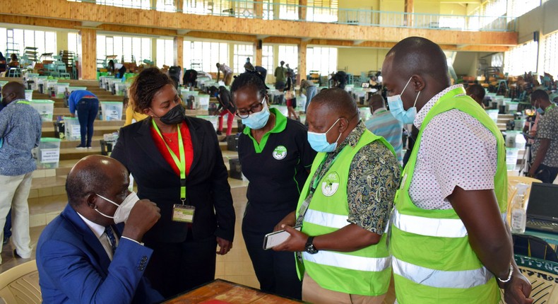 IEBC Chairperson Wafula Chebukati with elections officials at Mang'u Tallying Centre