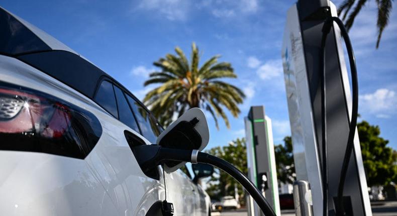 An electric vehicle charges in Torrance, California.PATRICK T. FALLON/AFP via Getty Images