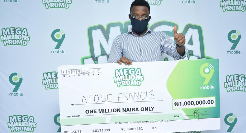 Atose Francis, N1million winner, giving the 9mobile brand a thumb up at the ongoing 9mobile Mega Millions Promo prize presentation in Ibadan.