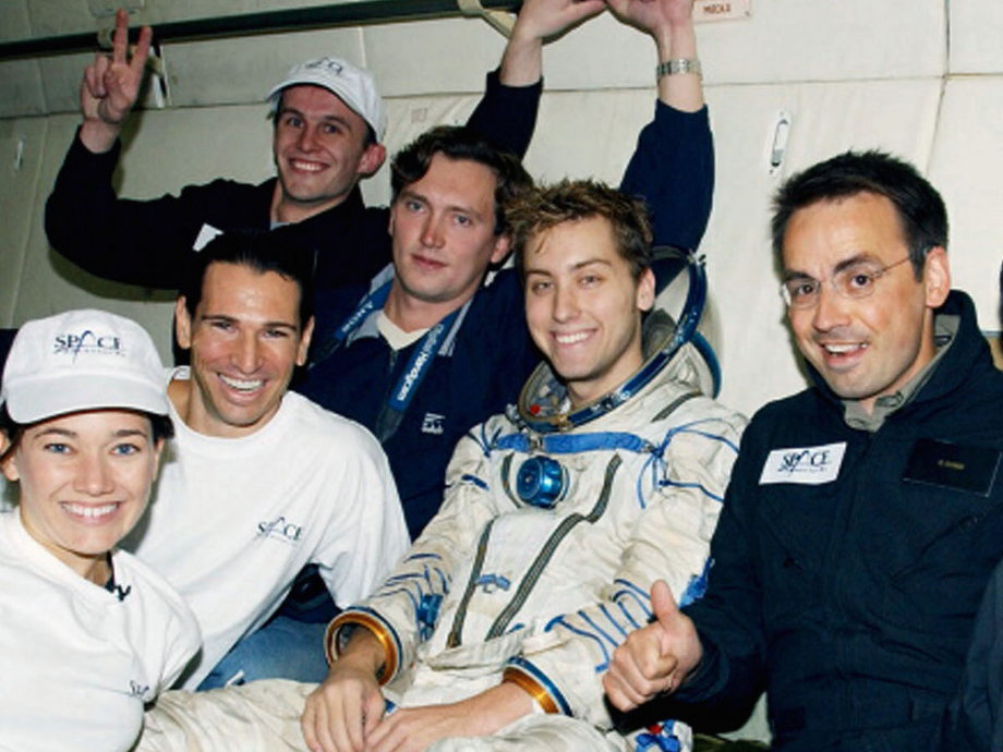 Lance Bass (center) joins Space Adventures on one of its scheduled Zero-Gravity training flights in August 2002 above Star City, Russia.