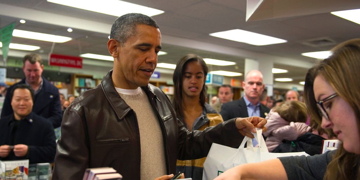 President Barack Obama shops with his daughter Malia in Washington.