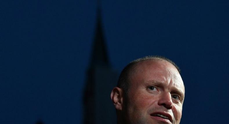 Malta's Prime Minister Joseph Muscat speaks to the media as he arrives in Salzburg, Austria on September 19, 2018 prior to a dinner as part of the EU Informal Summit of Heads of State or Government