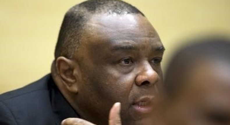 Former Congo vice-president Jean-Pierre Bemba looks up when sitting in the courtroom of the International Criminal Court to stand trial with Aime Kilolo Musamba, Jean-Jacques Mangenda Kabongo, Fidele Babala Wandu and Narcisse Arido, on charges including corrupting witnesses and interfering with the administration of justice in The Hague, Netherlands, September 29, 2015.  REUTERS/Peter Dejong/Pool