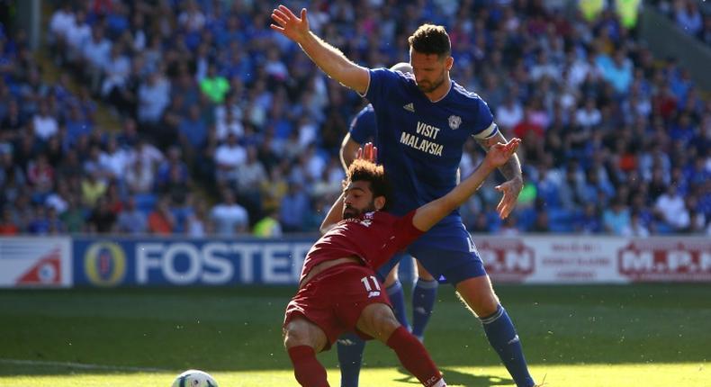 Liverpool's Egyptian forward Salah is fouled by Cardiff defender Morrison