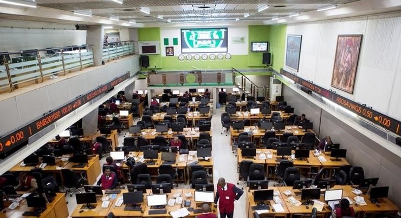 Traders work at the Nigerian Stock Exchange in Lagos