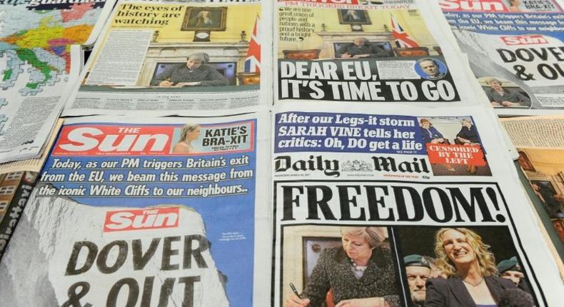 The front pages of Britain's national newspapers pictured in London on March 29, 2017, featuring British Prime Minister Theresa May's signing of a letter to invoke the provisions laid out in Article 50