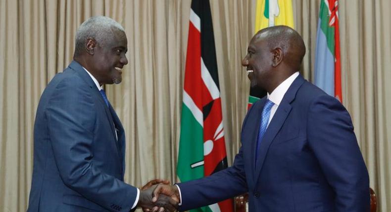 Chairperson of the African Union Commission Moussa Faki with President William Ruto