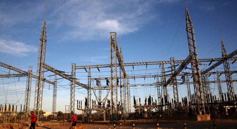 Security guards arrive with dogs for their shift at a power station in Gaborone, Botswana, November 23, 2015. REUTERS/Siphiwe Sibeko