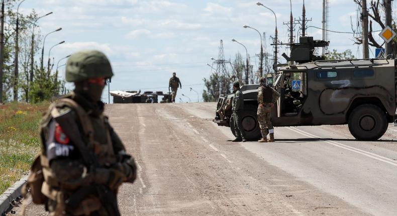 Pro-Russian forces seen outside the Azovstal steel mill in Mariupol, Ukraine, on May 16, 2022.