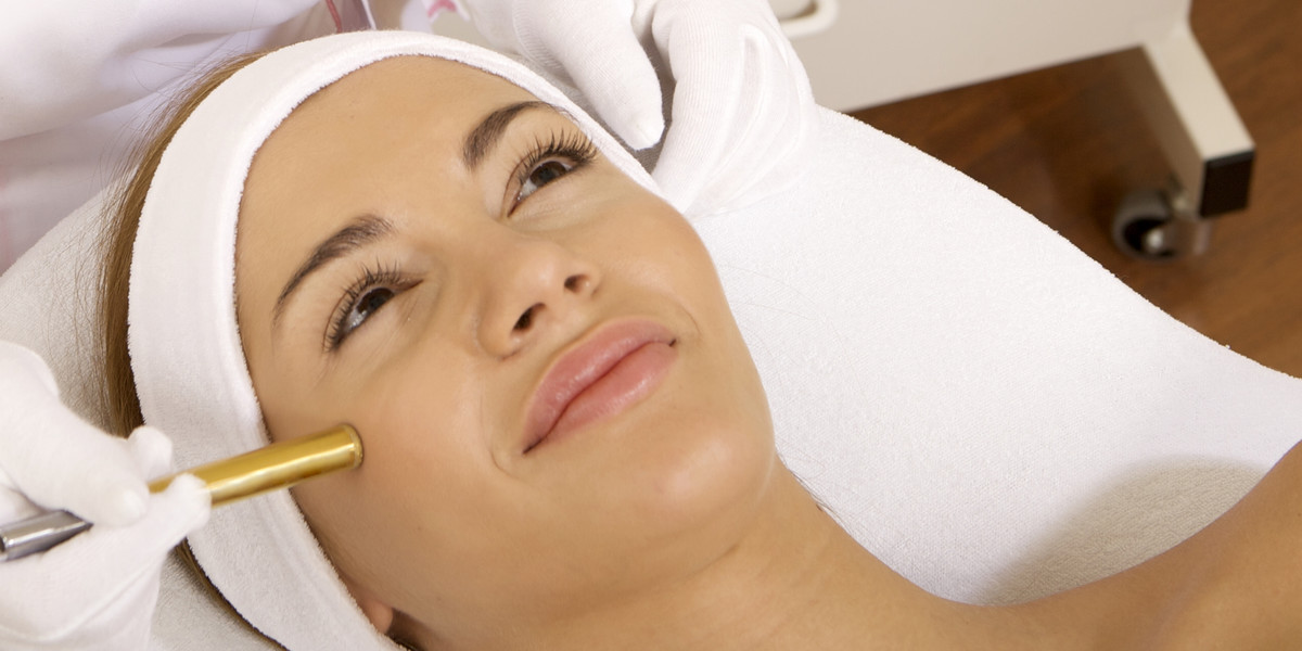 Young woman receiving laser therapy