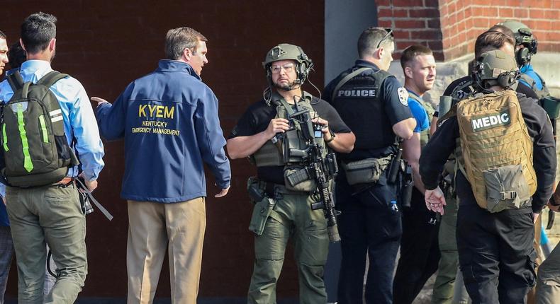 Kentucky Governor Andy Beshear speaks with police deploying at the scene of a mass shooting near Slugger Field baseball stadium in downtown Louisville, KentuckyMichael Clevenger/USA Today Network via Reuters