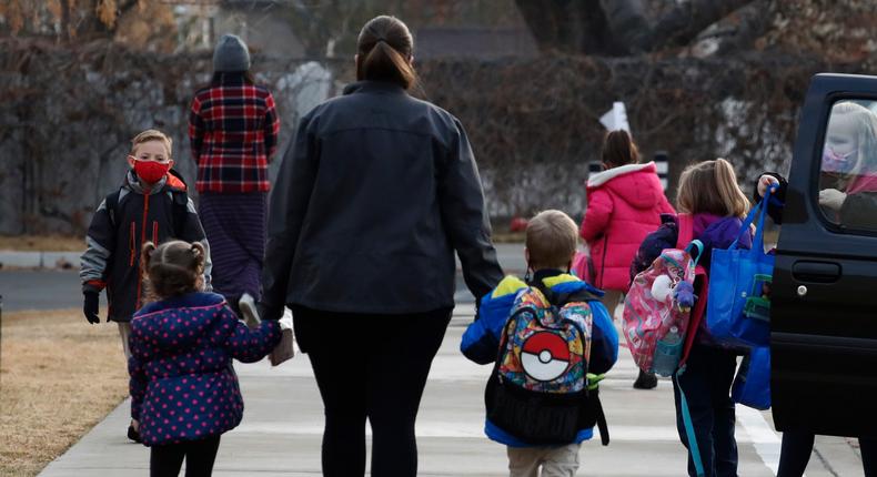 Parents drop their children off for school in Provo, Utah. A childcare crisis is raging across the country, and will only get worse when American Rescue plan funds run out at the end of the month.Photo by George Frey/Getty Images