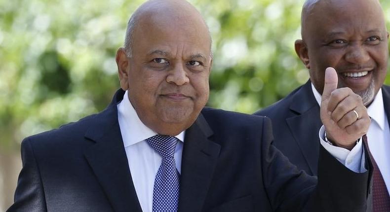 South Africa's Finance Minister Pravin Gordhan gestures as he arrives to deliver his 2016 budget address to the parliament in Cape Town, February 24, 2016. 