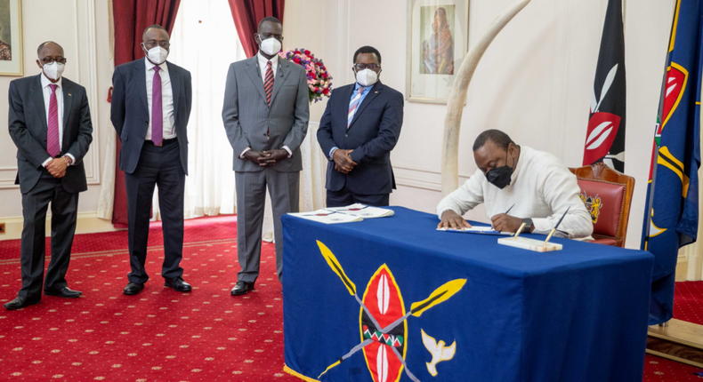 President Uhuru Kenyatta signs Political Parties (Amendment) Bill into law on January 27, 2022 at State House Nairobi