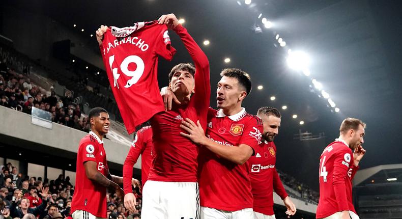 Manchester United's Alejandro Garnacho (left) celebrates after scoring his side s second goal of the game during the Premier League match at Craven Cottage on November 13, 2022.
