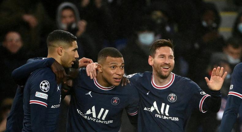 Kylian Mbappe (C) and Lionel Messi (R) will be key to PSG's hopes against Real Madrid in the Champions League last 16 Creator: FRANCK FIFE